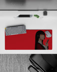 28x12 inches extended mouse pad in bold red and black, glowing red eyes and daring smile, sleek minimalist vibe.