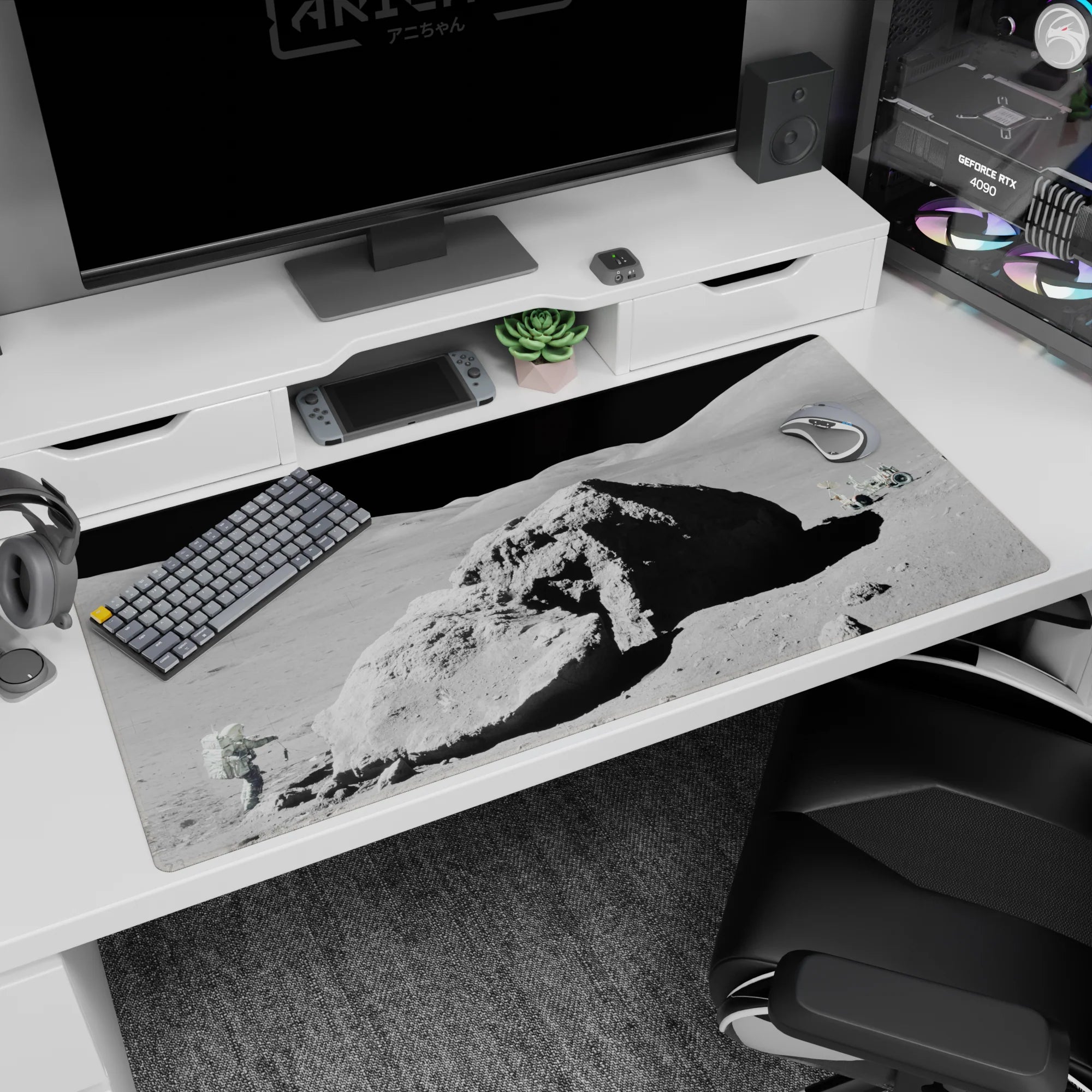 Chunky crater rock on a lunar landscape desk pad 40x20 inches, like a tiny rover scene on your desk.