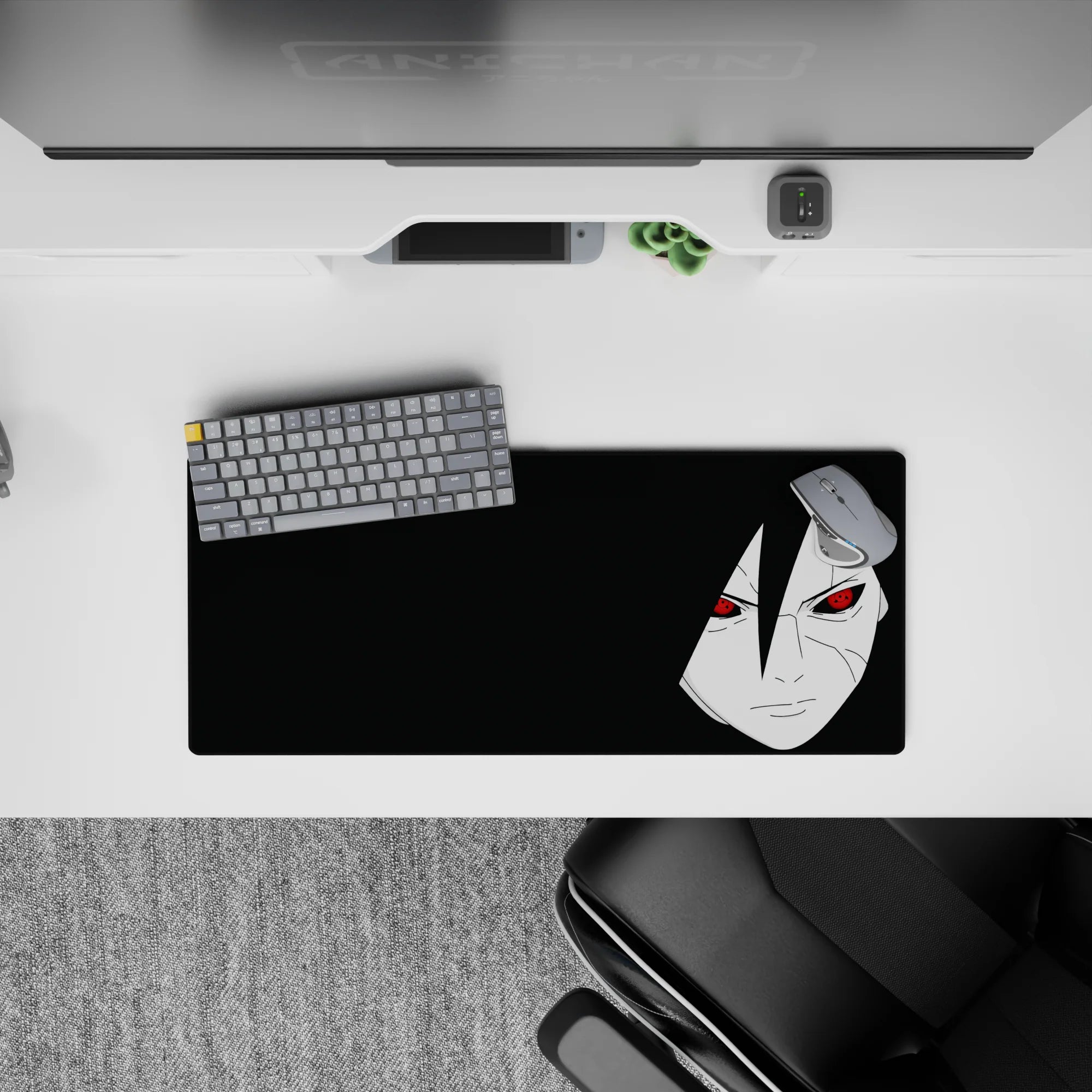 Dark black space anime mouse pad 28x12 inches with pale face and red Sharingan eyes, moody vibe.