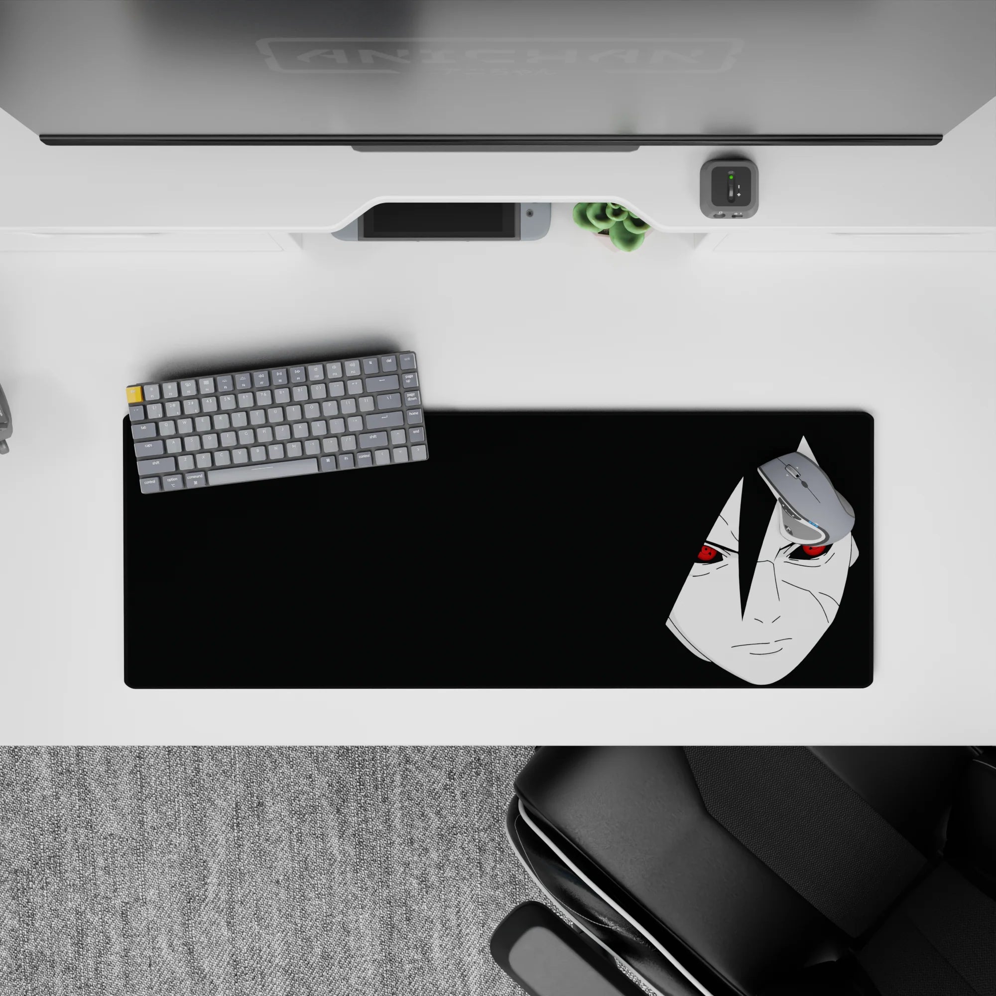Dark black Naruto desk mat with pale face and red Sharingan eyes, moody vibe, 32x12 inches.