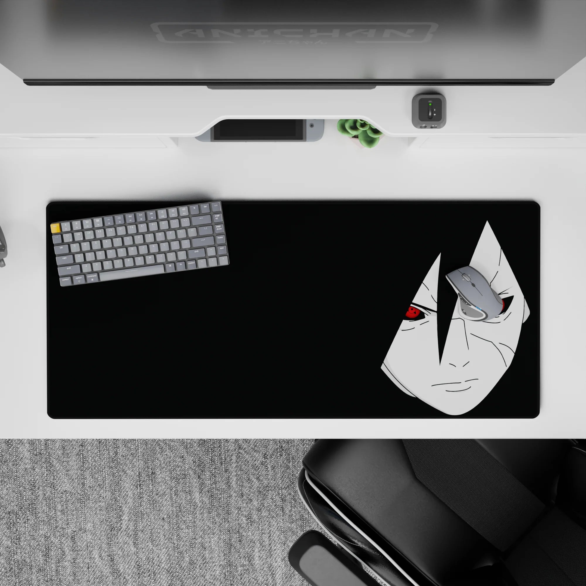 Dark black anime desk pad 36x16 inches with pale portrait and red Sharingan eyes, midnight mood.
