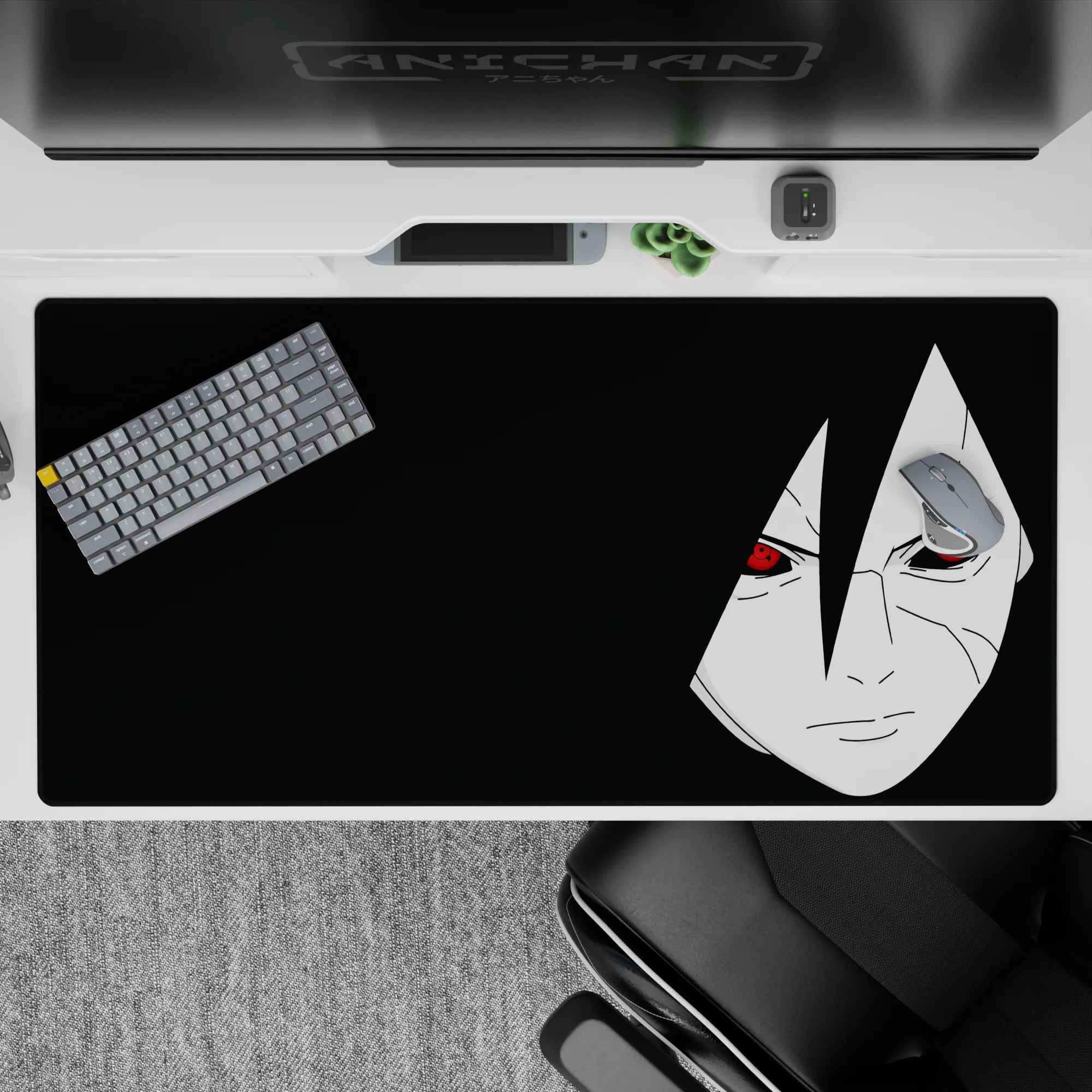 Dark black desk pad 40x20 inches with pale portrait and red Sharingan eyes, moody midnight vibe.