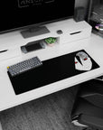 Sasuke Uchiha staring with glowing red Sharingan on black background anime mouse pad, 32x12 inches.