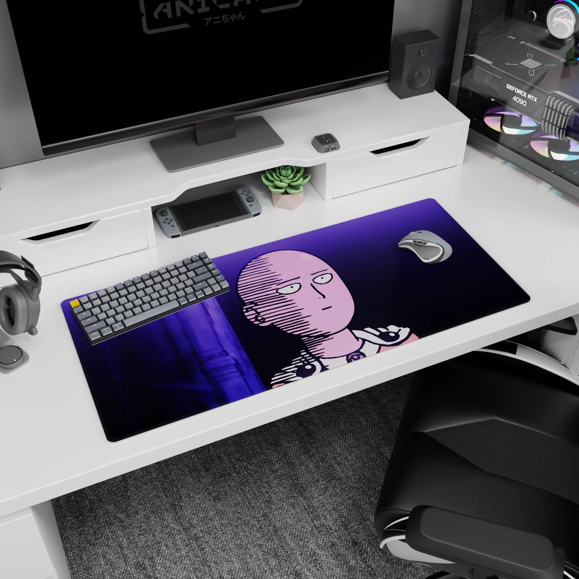36x16 inches anime desk pad showing Saitama staring ahead, bald head and cape clasp lit in violet neon.