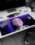 40x20 inches anime desk pad showing Saitama staring ahead, bald head and cape clasp outlined against purple structures.