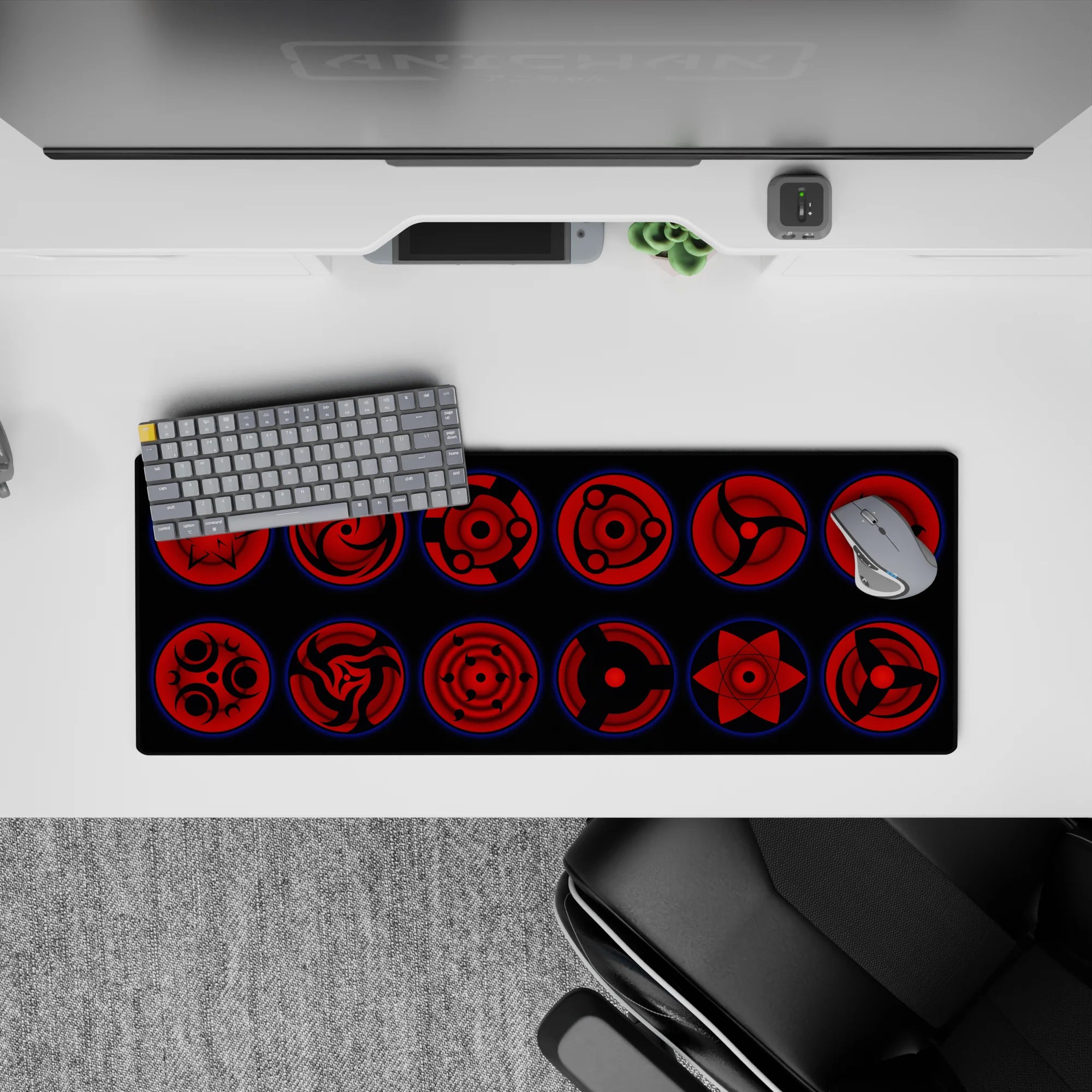 32x12 inches desk mat in deep crimson and black with glowing blue rims, dark and menacing Sharingan vibe.