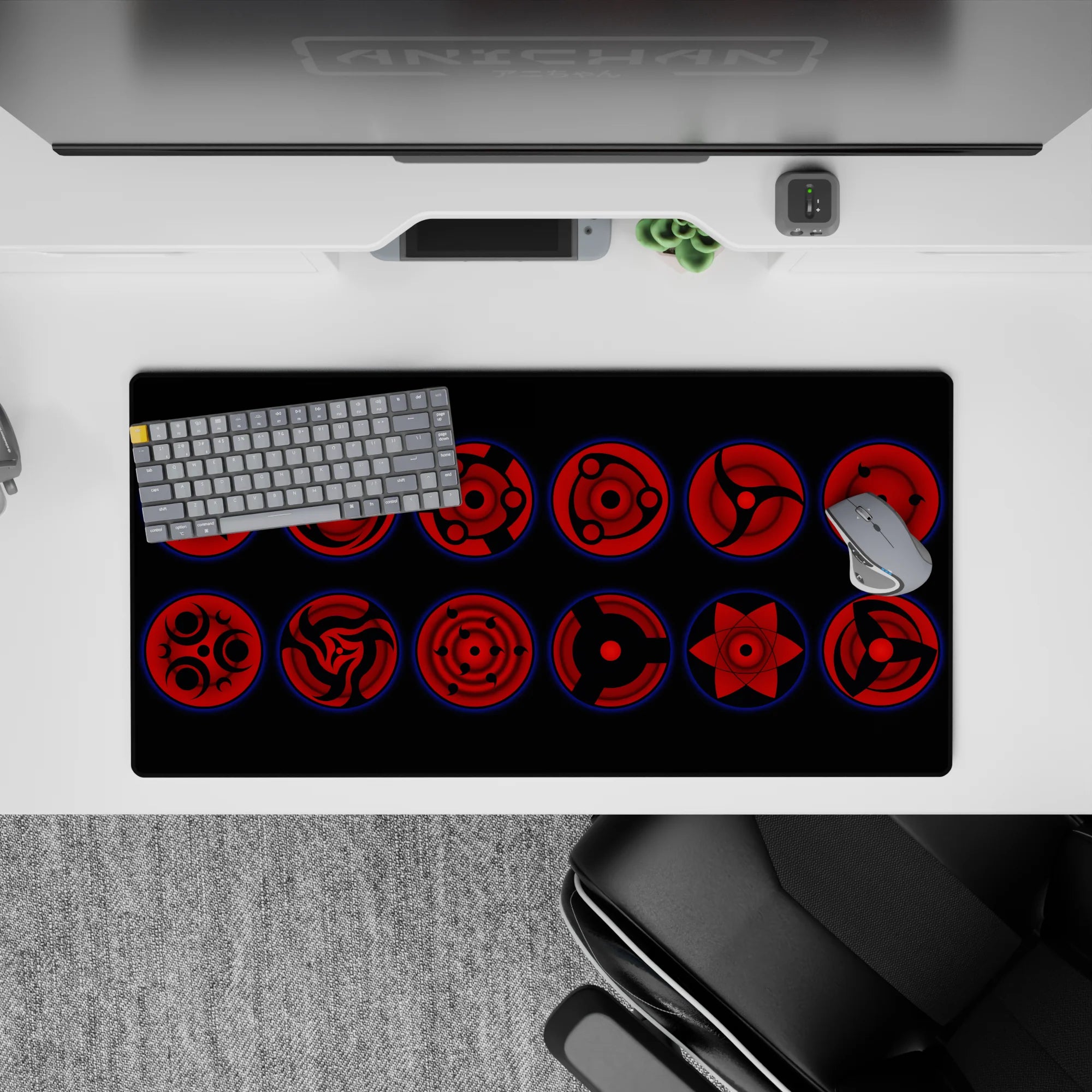 32x16 inches dark crimson Sharingan mouse pad with black tomoe and glowing blue rims, intense and sleek.