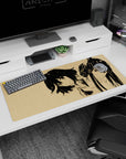 36x16 inches anime desk pad showing two girls: bob-haired smirk leaning in, ponytail glare standing tall.