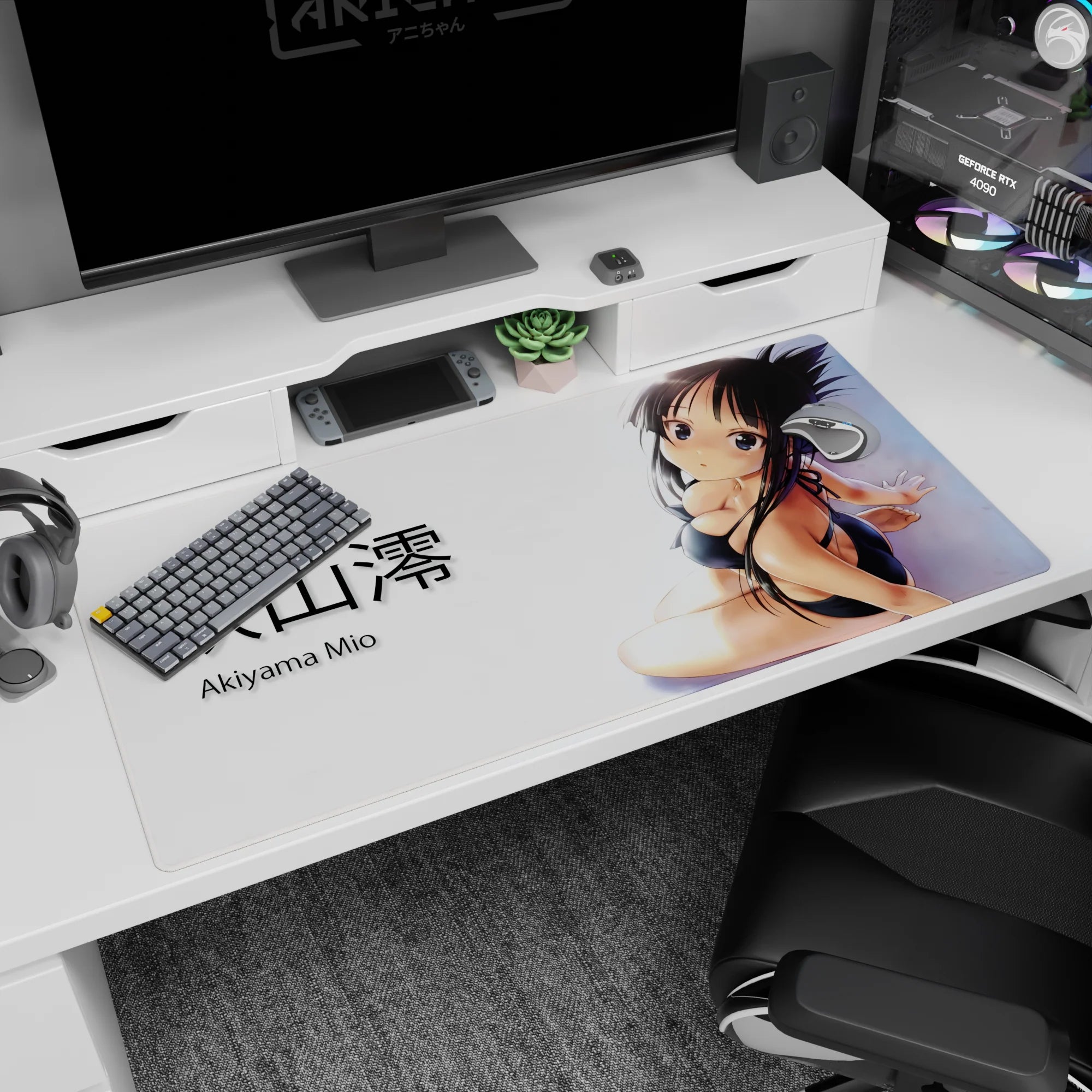 Akiyama Mio 40x20 inches desk pad, seated in black bikini with over-shoulder glance and ribboned hair.