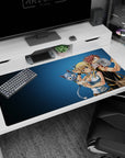 Natsu and Lucy sharing a mischievous moment with Happy floating close on a 40x20 inches desk pad.