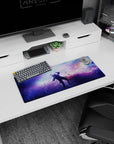 Star-speckled space cloud scene mouse pad 28x12 inches showing blurred nebula clouds and floating cosmic dust.