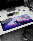 Star-speckled cosmic window scene desk pad 36x16 inches with floating dust across a nebula sky.