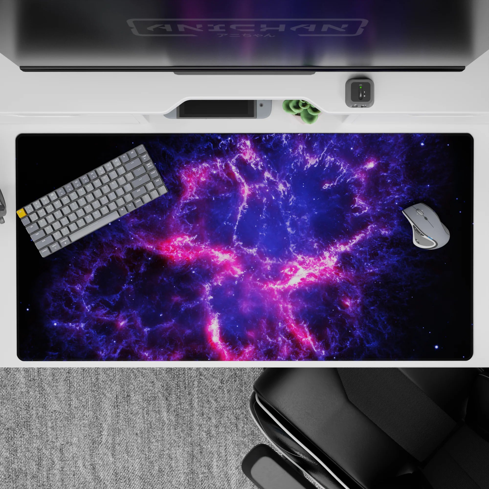 Cozy cosmic desk pad 40x20 inches in midnight blue, electric violet fog, and neon pink streaks.