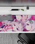 Pink-and-crimson anime desk pad 36x16 inches, playful best-friends chaos vibe, sweet contrast.