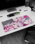 Winking pale-haired anime girl duo scene mouse pad 32x16 inches with candy-bright ribbons and eyes.