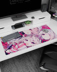 Winky pale-haired anime girl duo desk pad 36x16 inches with candy ribbons and ruby eyes scene.
