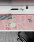 Anime desk pad featuring Zero Two from Darling in the Franxx, in soft blush tones, size 36x16 inches.