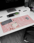 Anime desk pad featuring Zero Two from Darling in the Franxx, 36x16 inches, in soft blush tones and pastel pink background.