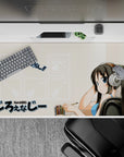 Cozy beige anime desk pad 40x20 inches with soft colors, clean lines, and K-ON! style charm.