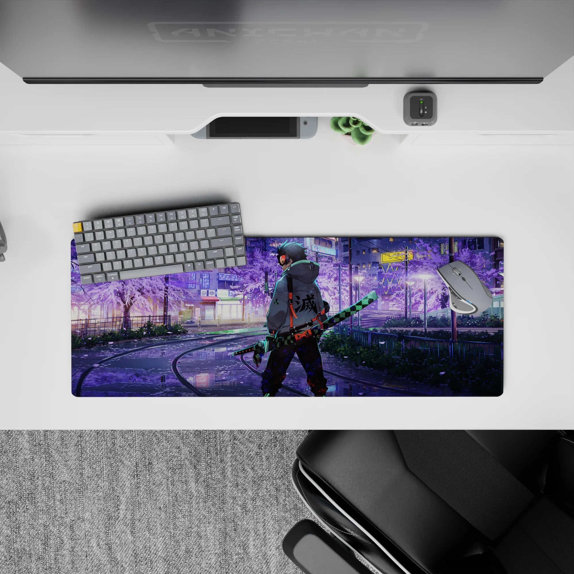 Anime mouse pad featuring Tanjiro from Demon Slayer walking in neon-lit city, sakura tones; size 32x12 inches.