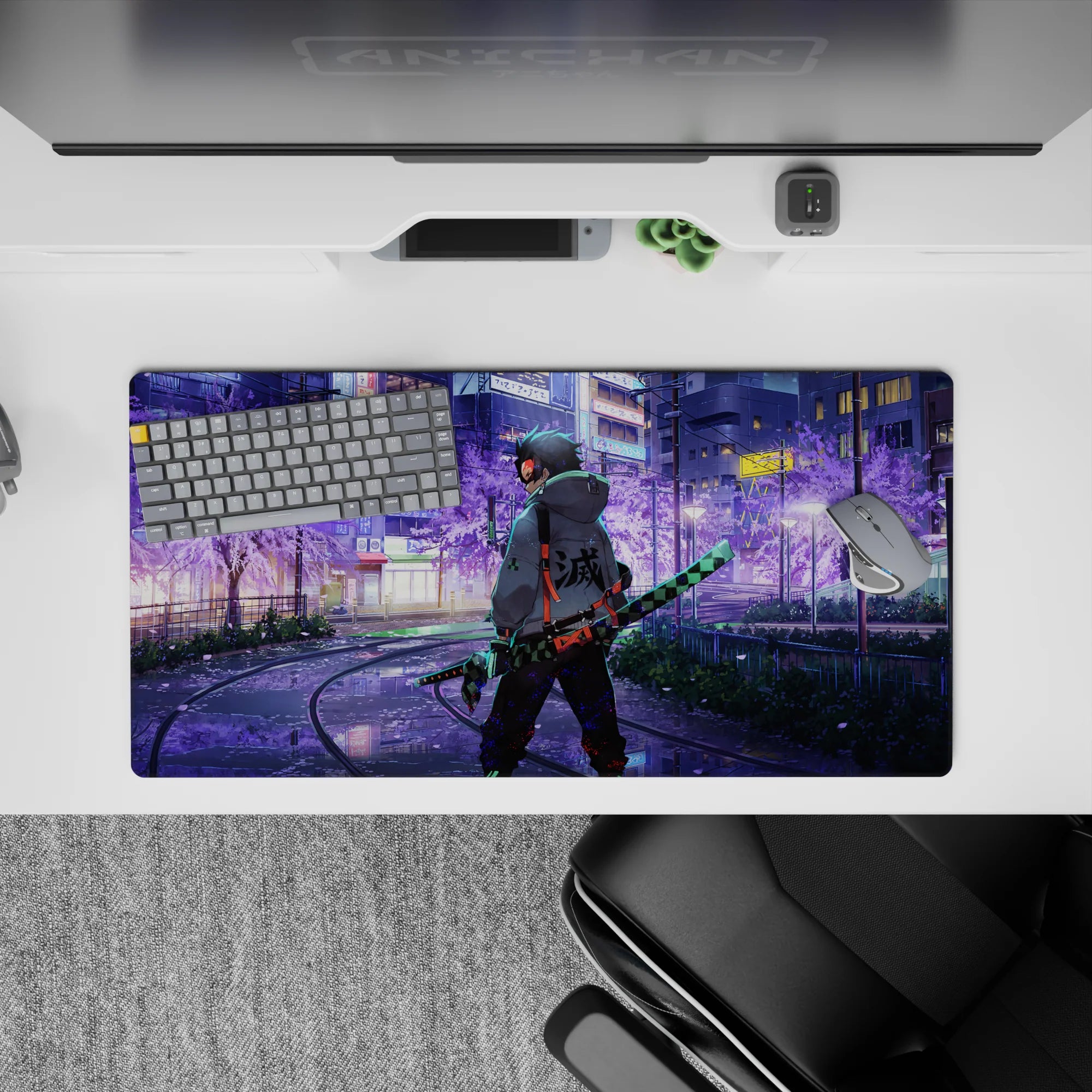 Anime mouse pad 32x16 inches featuring Tanjiro from Demon Slayer in neon-lit city with sakura tones and iconic blade.