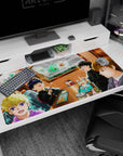 Four anime students in black uniforms plus a suited friend in a booth on 40x20 inches desk pad.