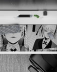 36x16 inches black-and-white manga desk pad with bold shading, striped backdrop, cool smirking vibe.