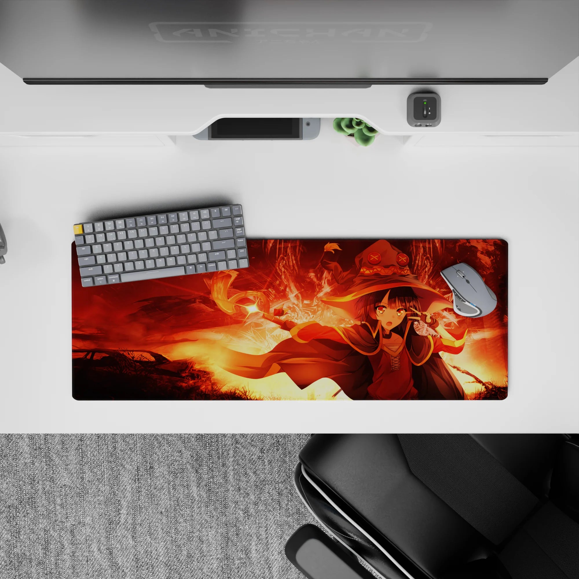 Megumin from KonoSuba in explosive magic pose on anime mouse pad, 32x12 inches. Bold reds and golds create intense scene.