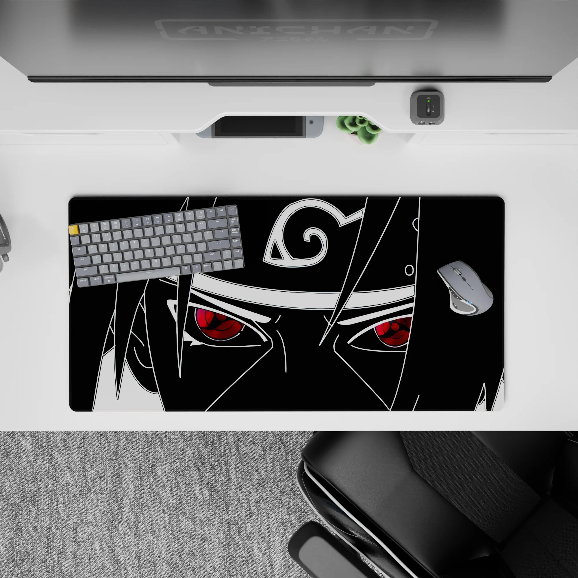 Minimal monochrome anime desk mat with crimson Sharingan pop, intense vibe, 32x16 inches.