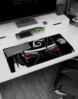 Sasuke Uchiha staring forward with Sharingan eyes and Leaf headband, Naruto mouse pad 32x16 inches.