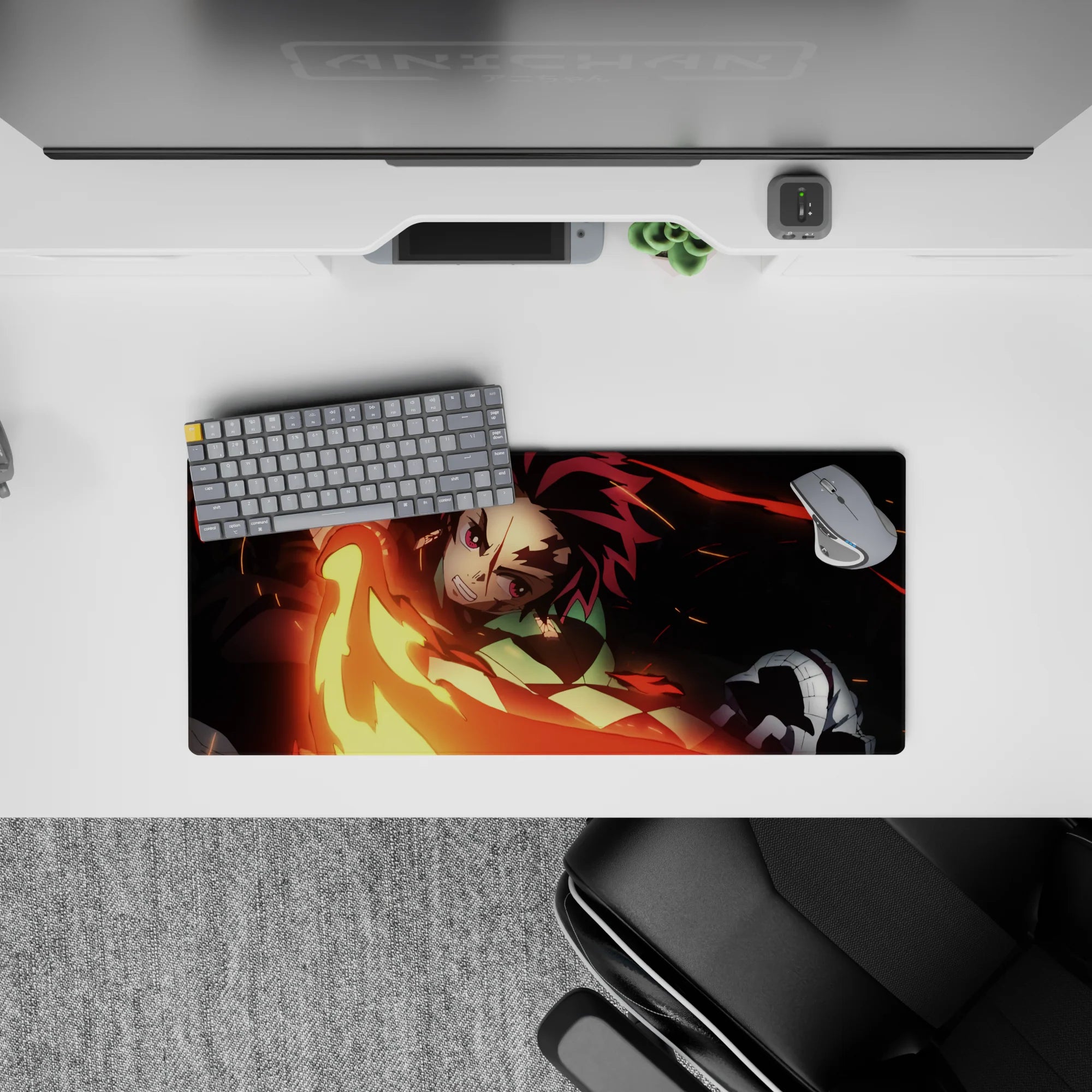 Anime mouse pad 28x12 inches featuring Tanjiro's fiery sword swing from Demon Slayer, in vivid reds and golds.