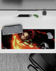 Anime mouse pad 32x12 inches featuring Tanjiro from Demon Slayer with fiery sword swing in red, gold, and embers.