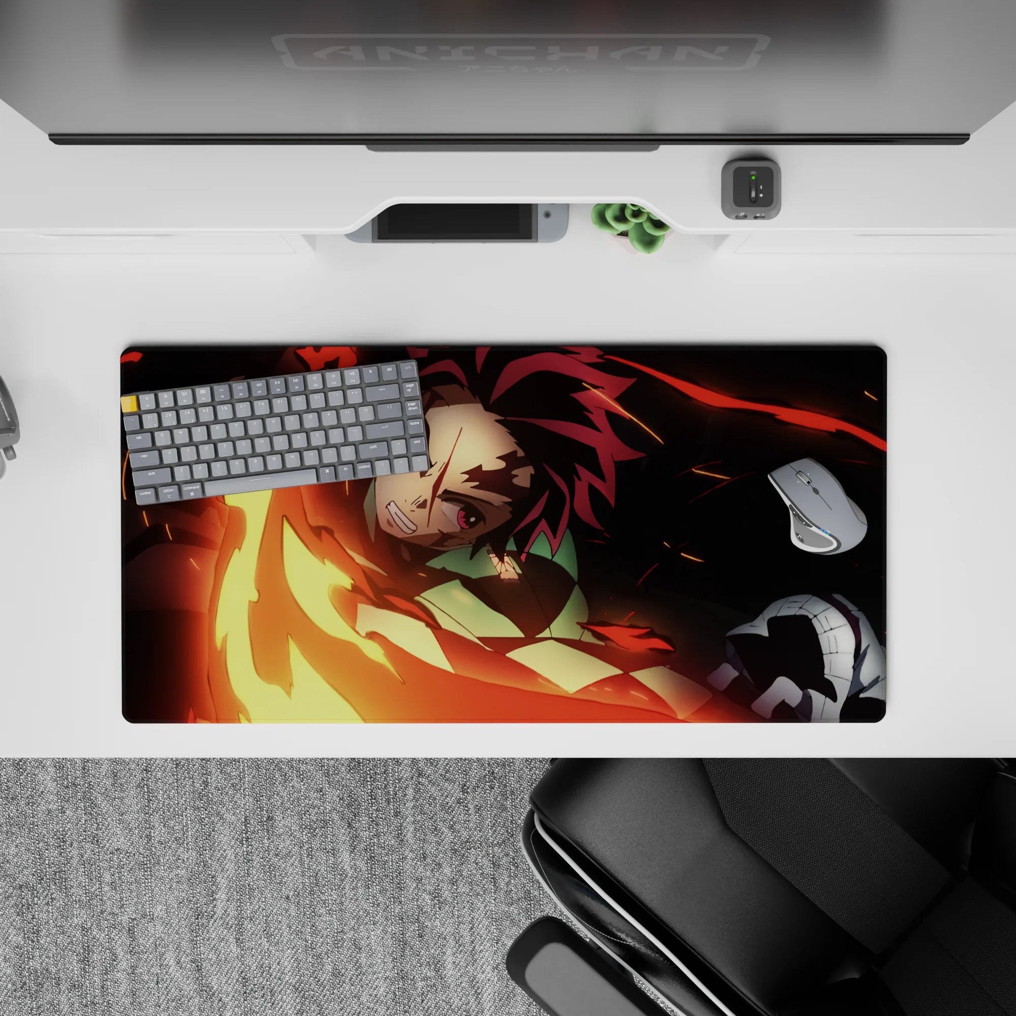 Tanjiro from Demon Slayer unleashes fiery sword swing on 32x16 inch anime mouse pad, vivid reds and golds.