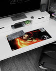 Anime mouse pad 28x12 inches featuring Tanjiro from Demon Slayer, sword blazing in fiery reds and golds, intense action.