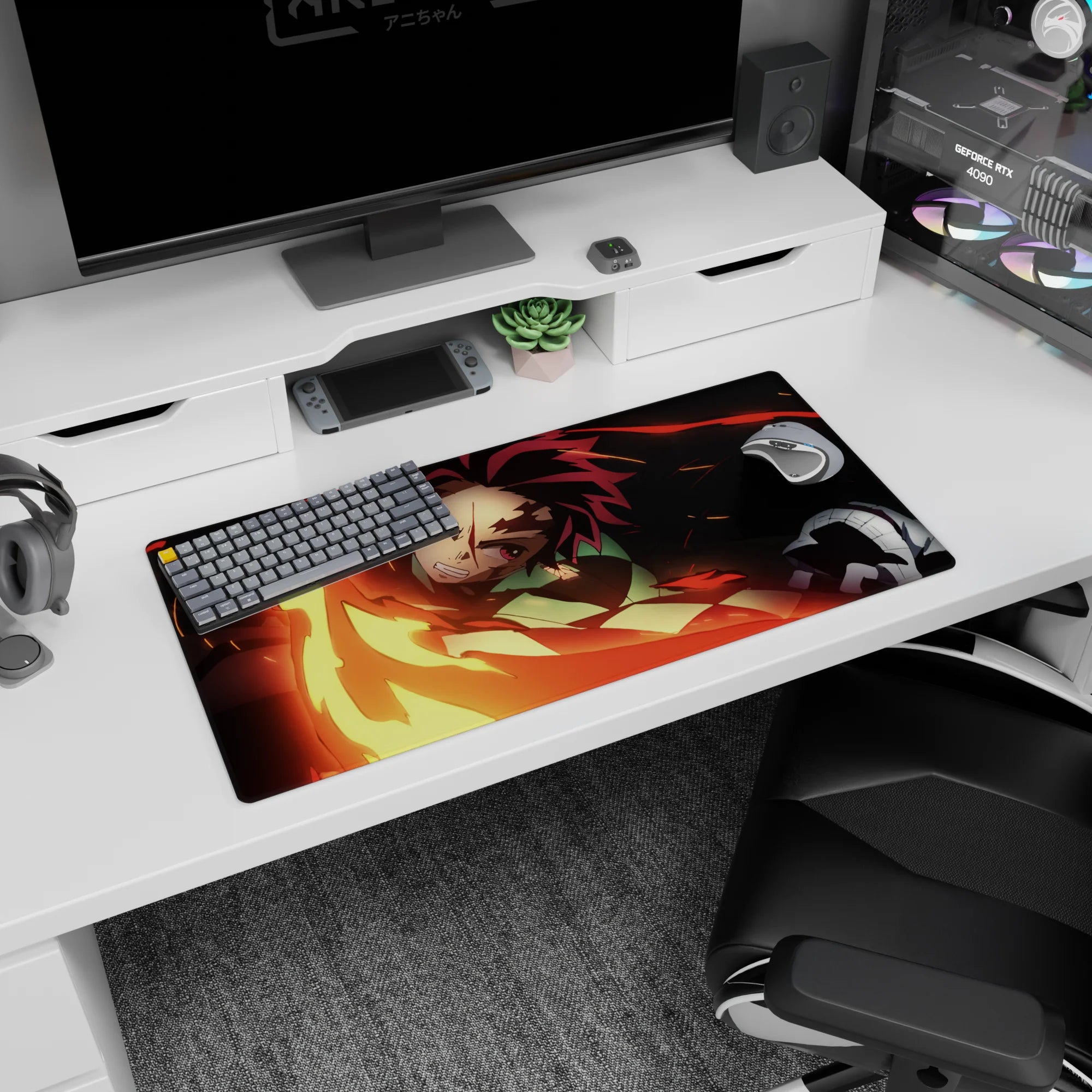 Tanjiro from Demon Slayer wielding a fiery sword on a 32x16 inch anime mouse pad, vivid reds and golds against a black backdrop.