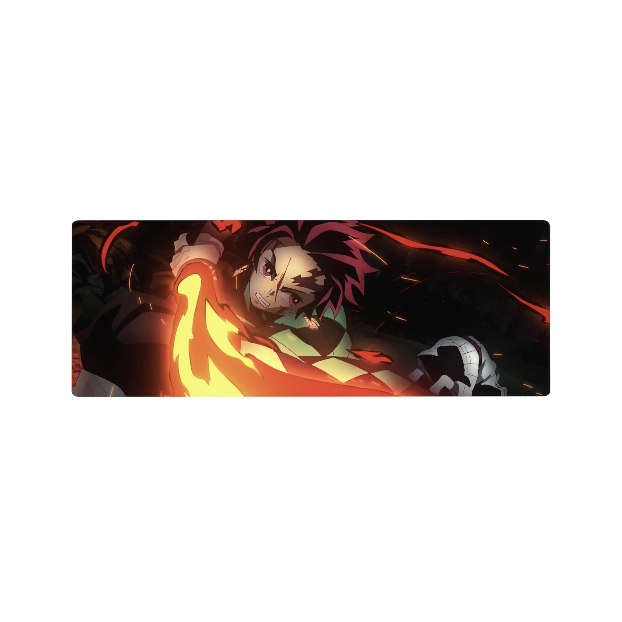 Tanjiro unleashes fiery sword swing on 32x12 inch anime mouse pad, vivid reds and golds against a black backdrop.