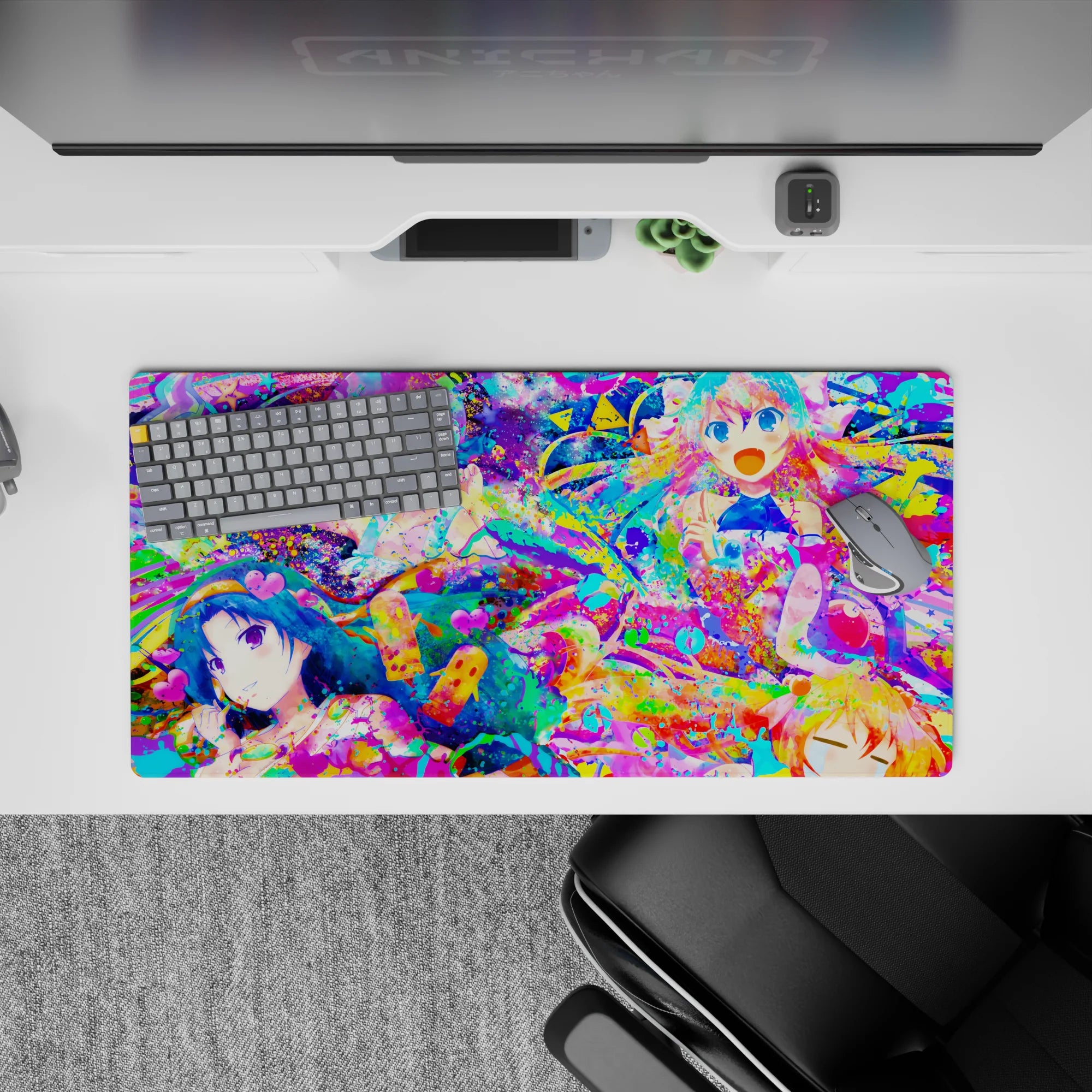 32x16 inches anime girl mouse pad in hot pink, aqua, and lemon yellow splatter art with playful idol vibe.