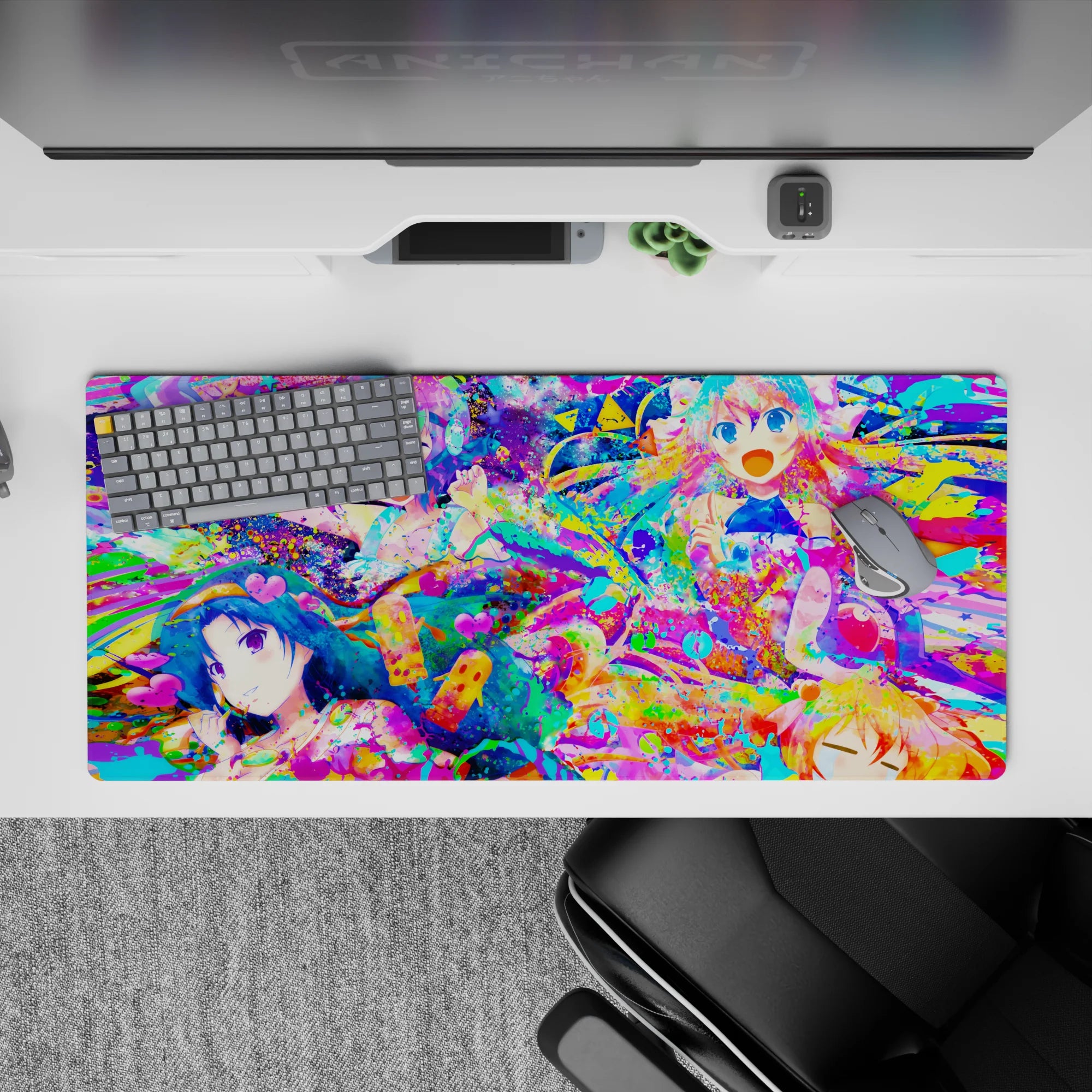 36x16 inches neon pink, aqua and lemon yellow anime desk pad, candy-splash chaos with confetti.