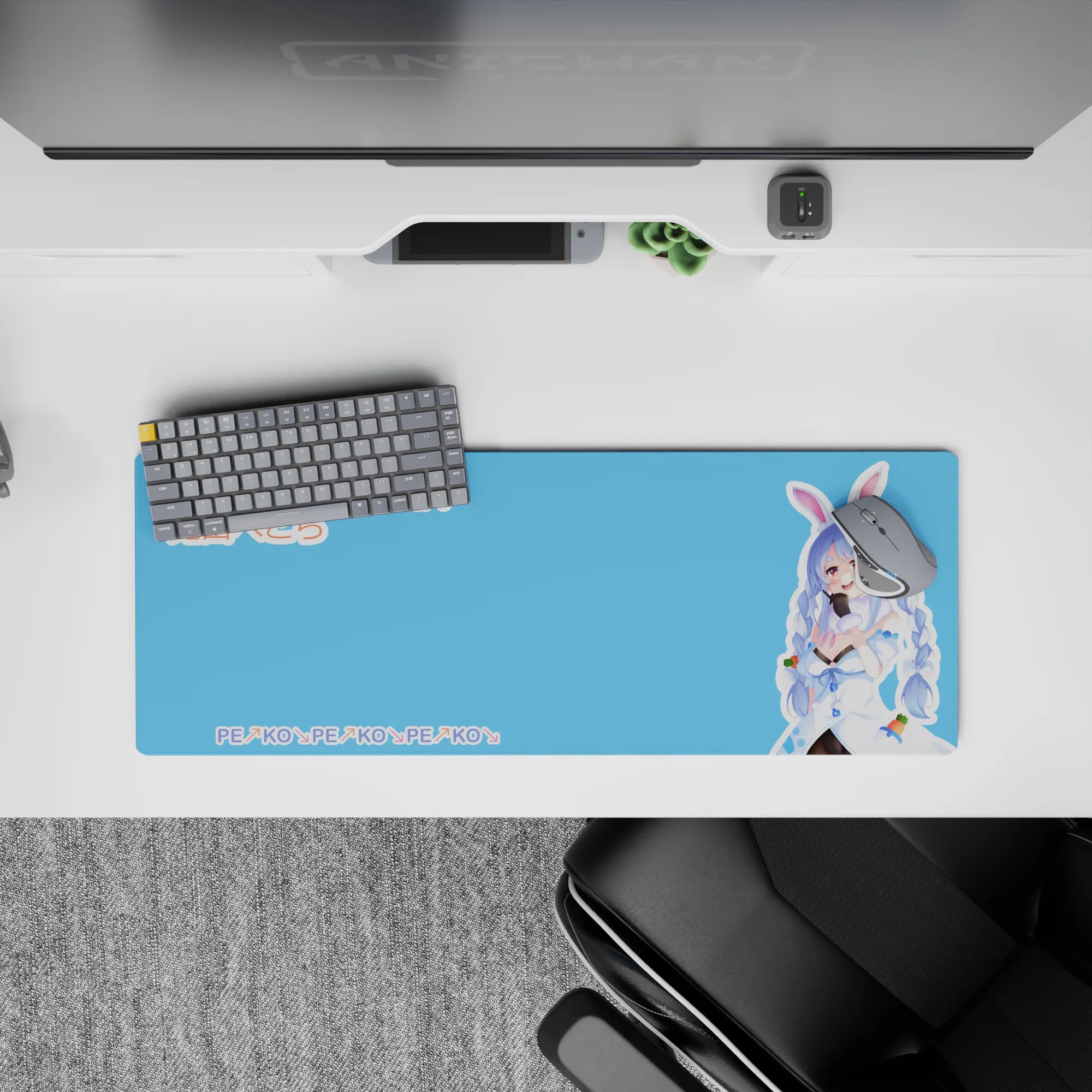 Cute clean desk mat in bright sky-blue and candy pastels with PEKO PEKO pattern, 32x12 inches.