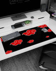 Itachi Uchiha Akatsuki theme anime desk pad, 36x16 inches, red clouds on black for gaming.