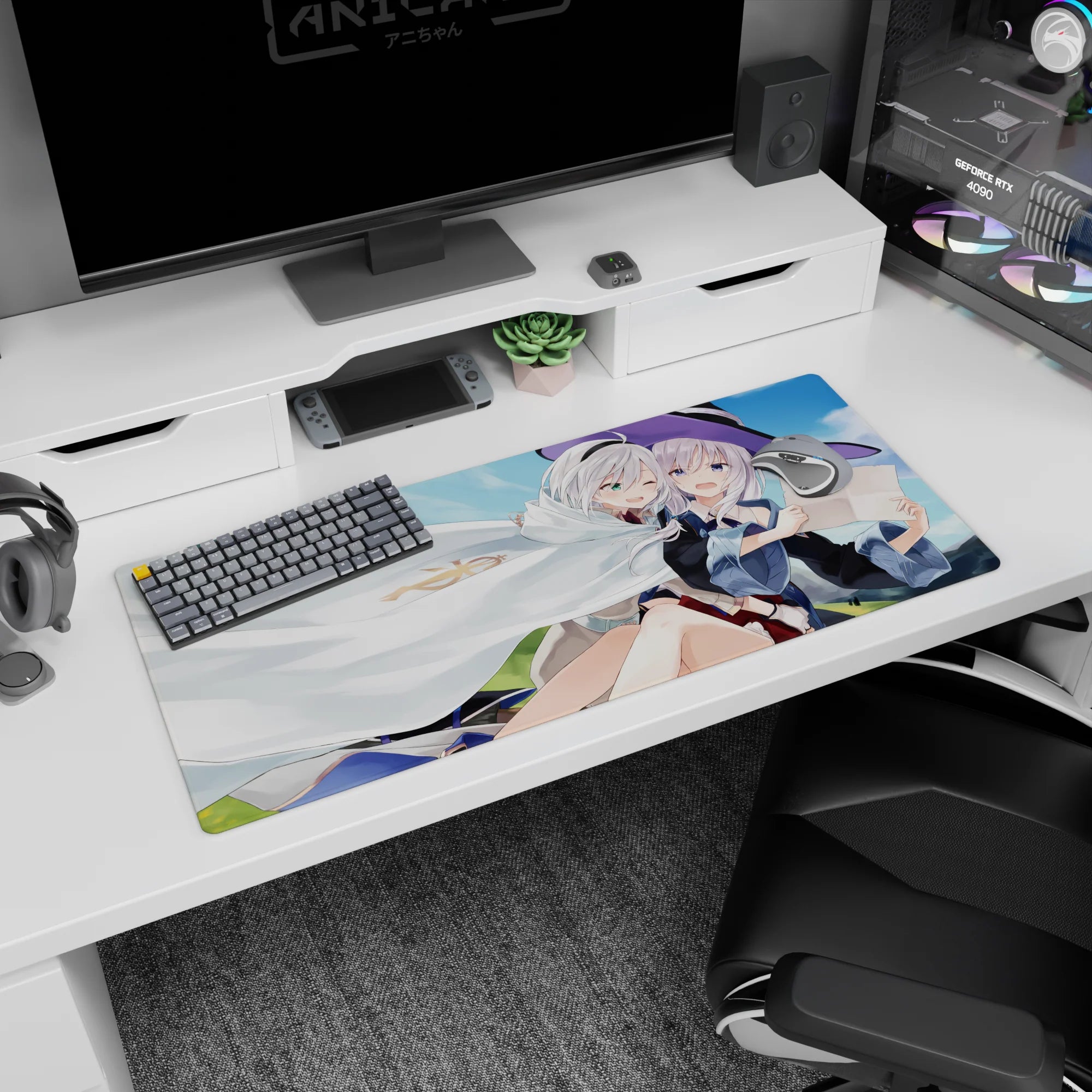Two silver-haired anime girls cuddling, one in a violet witch hat, desk pad 36x16 inches.