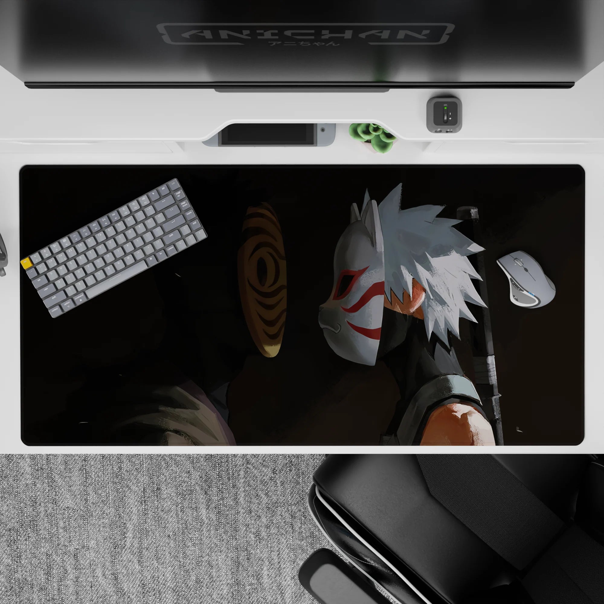 Dark charcoal shadow anime desk pad 40x20 inches with bright orange spiral mask and crisp white-red accents.