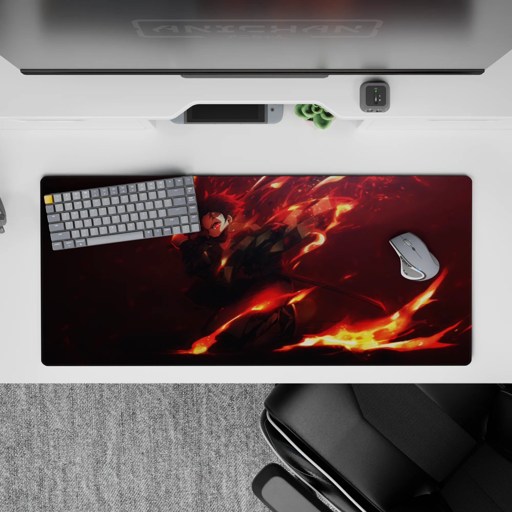 Anime desk pad featuring Tanjiro from Demon Slayer, 36x16 inches, with fiery reds and blacks, capturing dynamic motion.