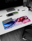 Anime girl mouse pad 32x12 inches showing two fierce anime girls locking eyes, hair whipping, teeth clenched.
