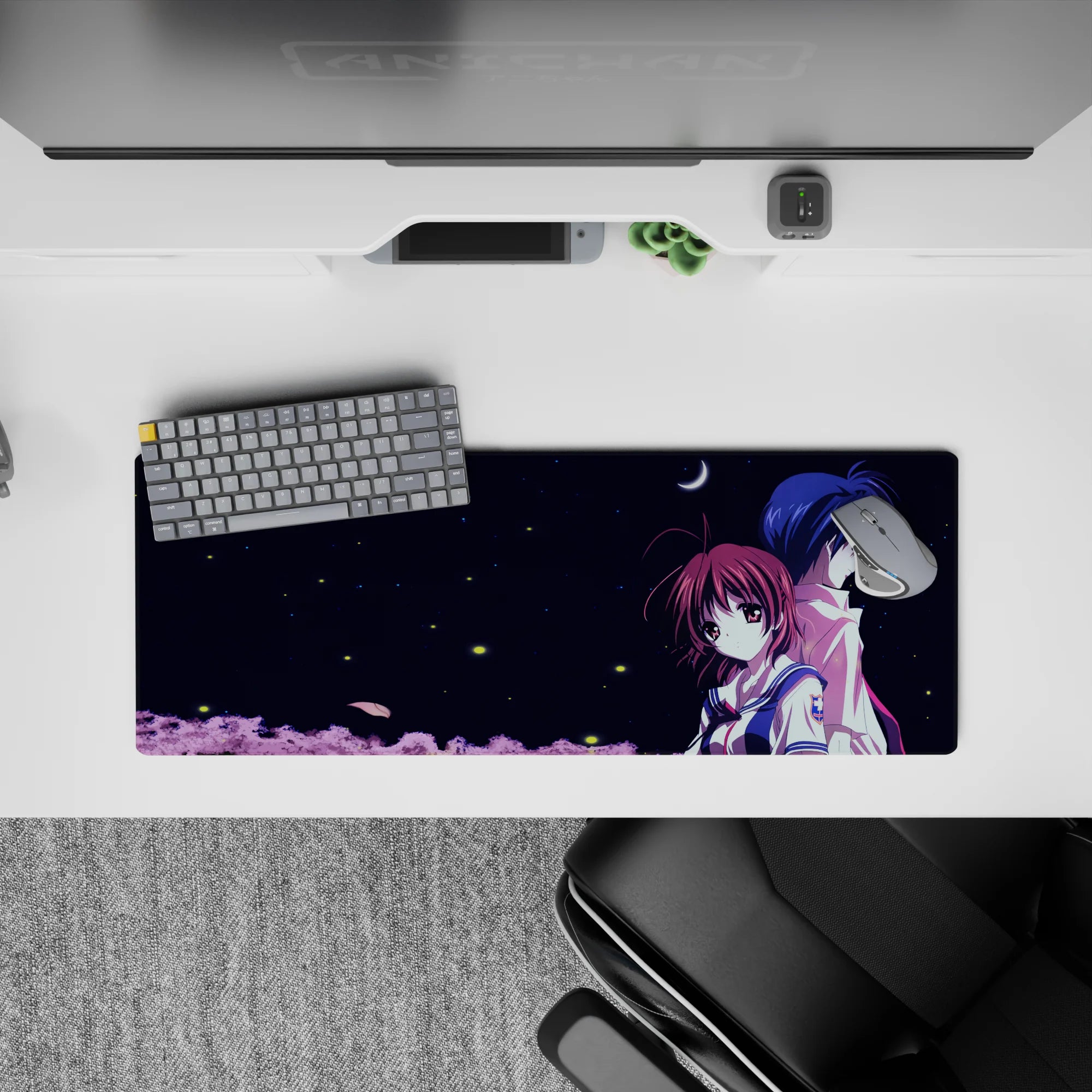 32x12 inches anime mouse pad in midnight navy with crisp white accents and soft pink treetops, calm mood.