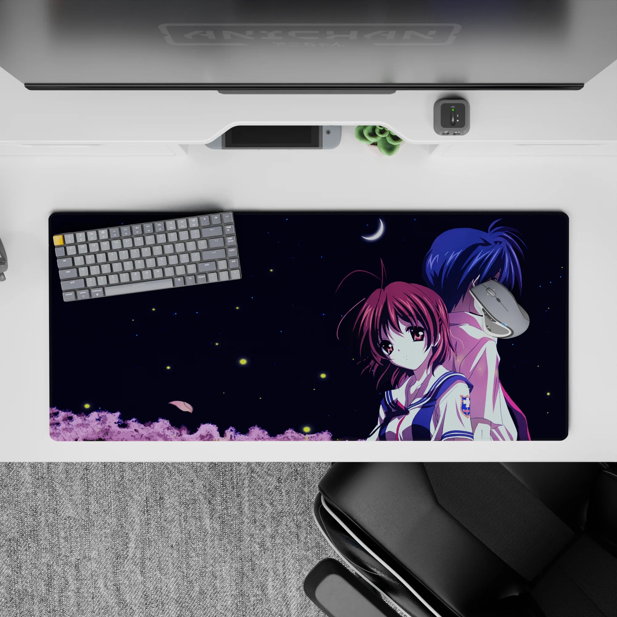 36x16 inches anime desk pad in midnight blues and white navy, calm romantic night mood with soft pink trees.