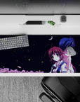 36x16 inches anime desk pad in midnight blues and white navy, calm romantic night mood with soft pink trees.