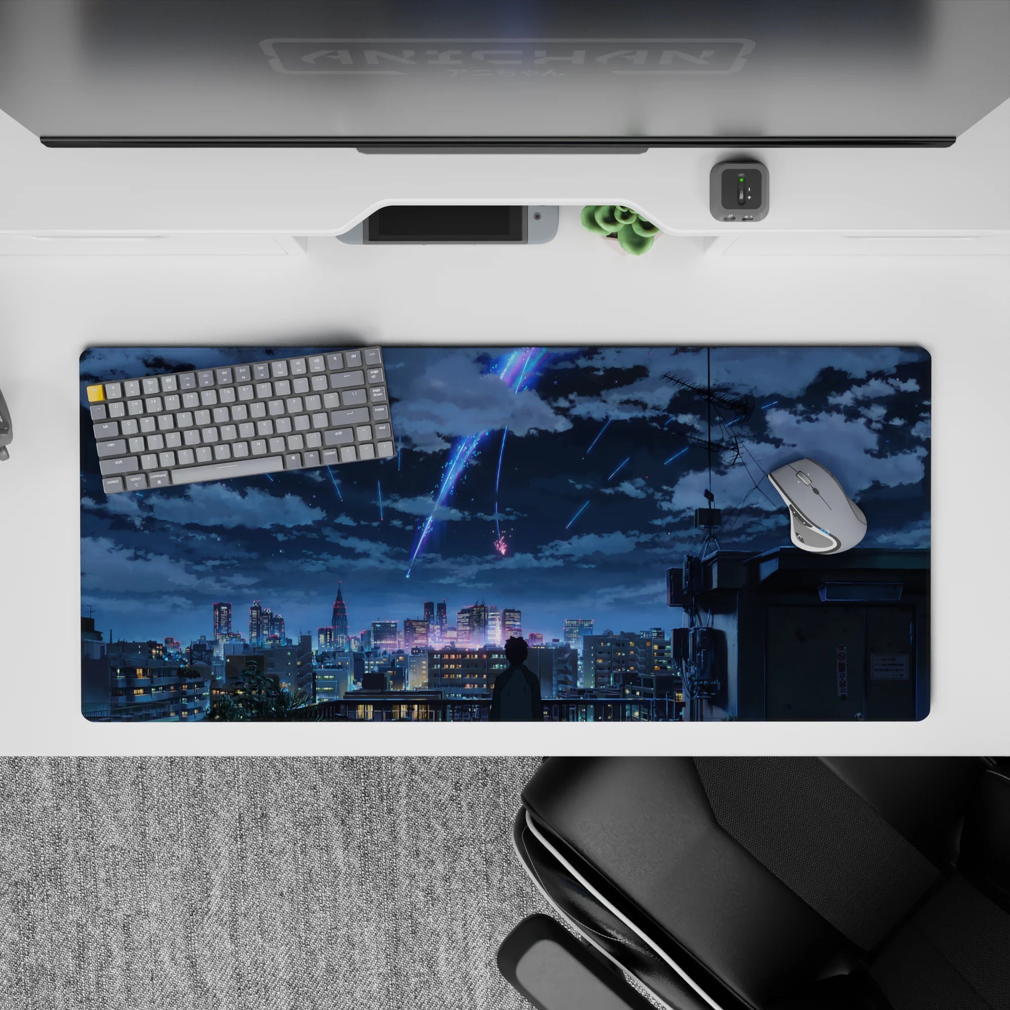 36x16 inches anime desk pad in neon blue and violet, dreamy skyline mood with deep navy shadows.