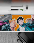 Fiery orange background anime desk pad 36x16 inches, bold rally-cry vibe with sharp blue uniform accents.