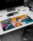 Edward Elric scowls front, Alphonse in armor behind on anime desk pad 36x16 inches.
